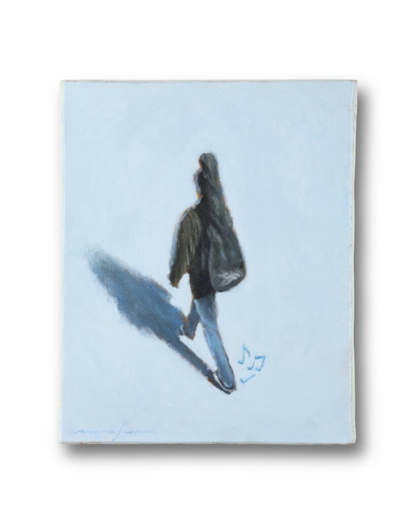 ギターを背負った男性