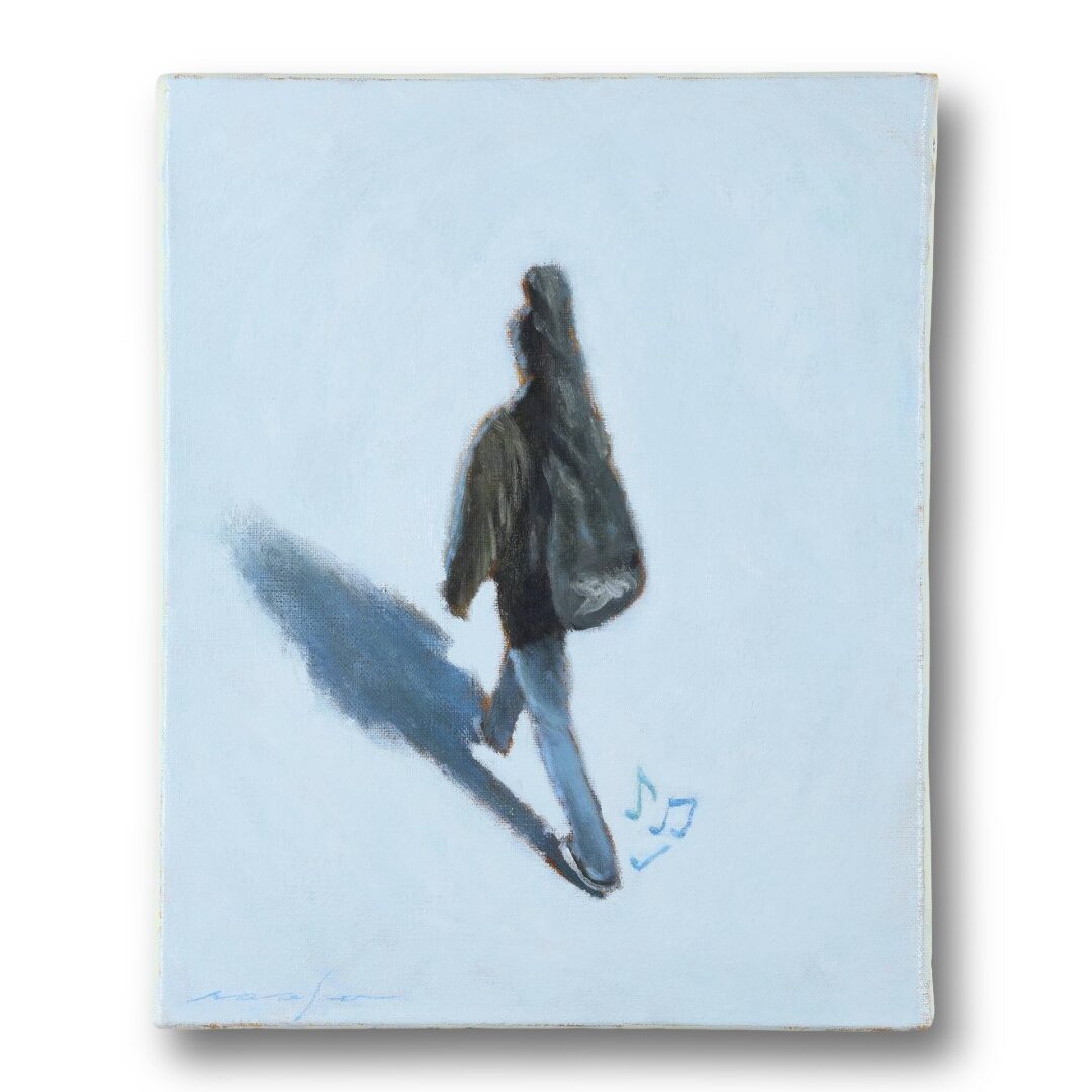 ギターを背負った男性